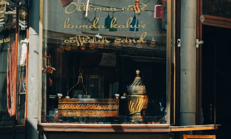 Historic Istanbul street with a traditional Turkish coffee cafe exterior, warm storefront details, and old city architecture