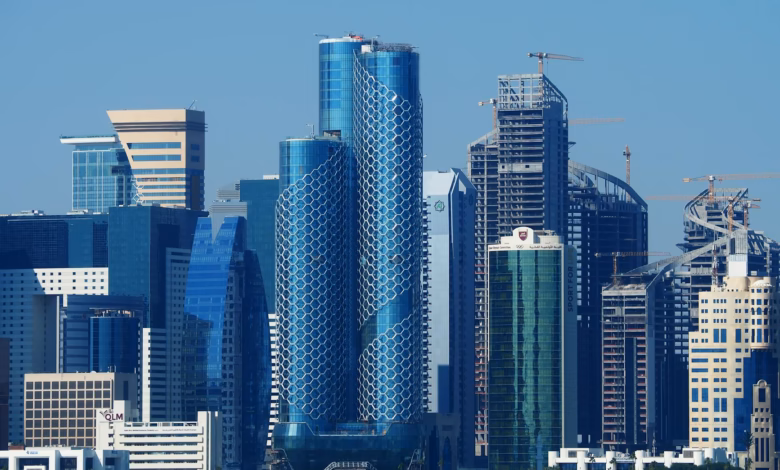 Doha modern skyline along the waterfront with futuristic glass towers and distinctive Qatar architecture reflected in the cit