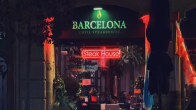 Barcelona street scene with tapas bars, outdoor restaurant terraces, and historic Catalan architecture in the city center.
