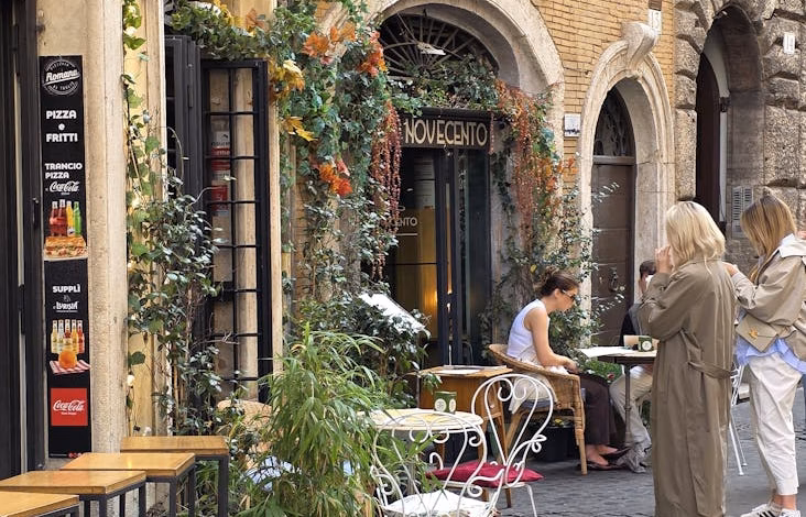 Historic Rome cafe exterior on a cobblestone street, capturing Italian coffee culture, old-world architecture, and food touri