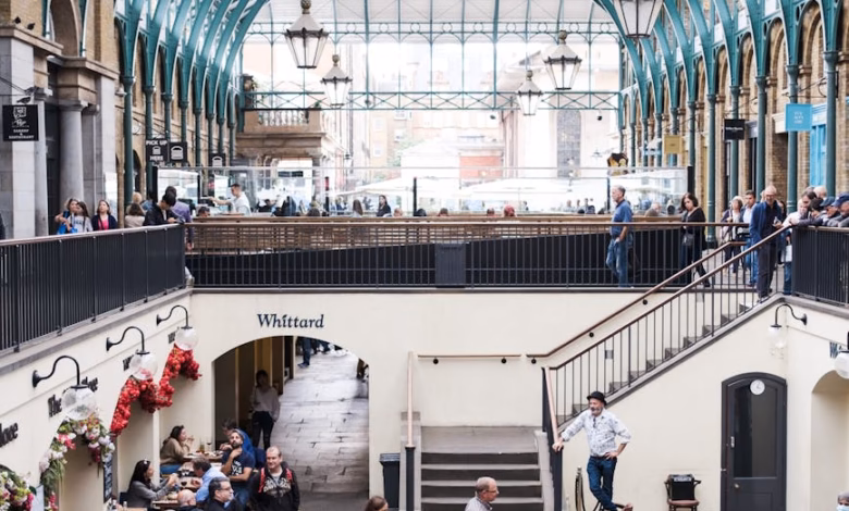 Covent Garden London cafe exterior with historic market architecture and a cozy coffee shop on a charming London street.