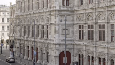 Elegant Vienna coffee house exterior on a historic street, showcasing Austria cafe culture and ornate architecture.
