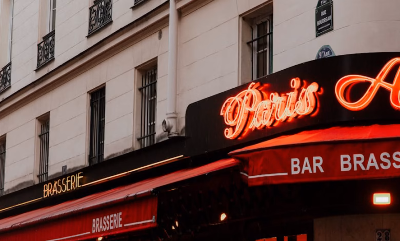 Paris city street with halal dining area storefronts, classic French architecture, and a bustling restaurant exterior in a Mu