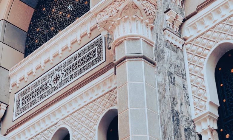 Makkah holy city architecture with the Grand Mosque exterior and surrounding Islamic heritage skyline, a significant ziyarat