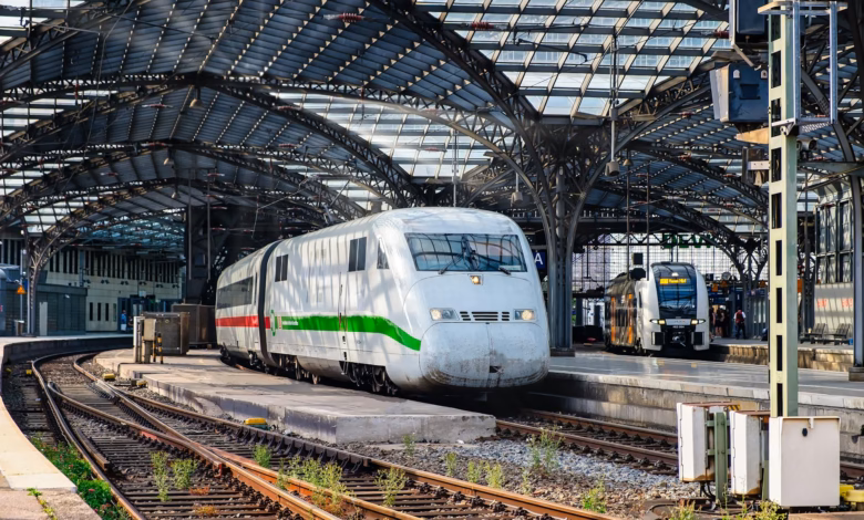 A modern train station beside a walkable city skyline, highlighting train friendly destinations with easy rail travel and urb
