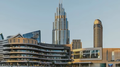 Dubai Mall exterior with sleek city architecture and the modern skyline of Downtown Dubai, a landmark shopping destination in