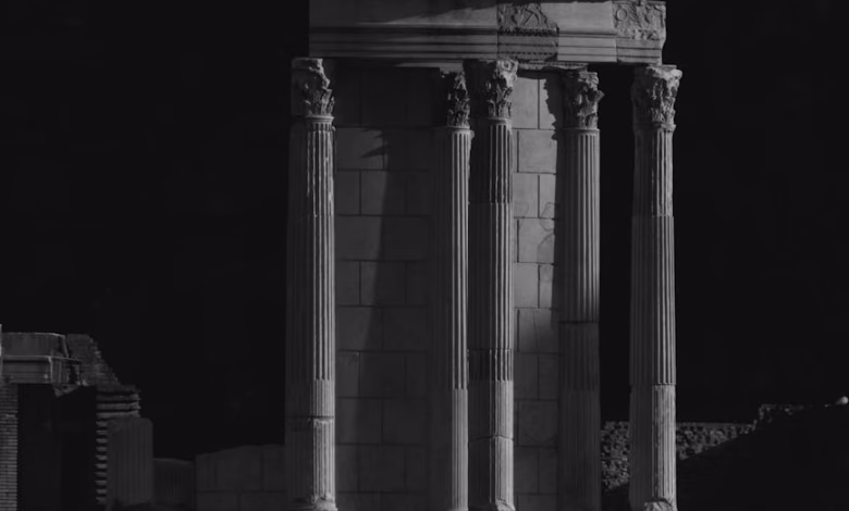 Historic Roman ruins with weathered stone columns and ancient Roman architecture in Italy, showcasing a landmark of classical