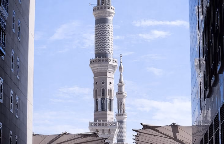 Historic mosque exterior in Madinah, Saudi Arabia, featuring heritage landmarks and a peaceful city view with Islamic archite
