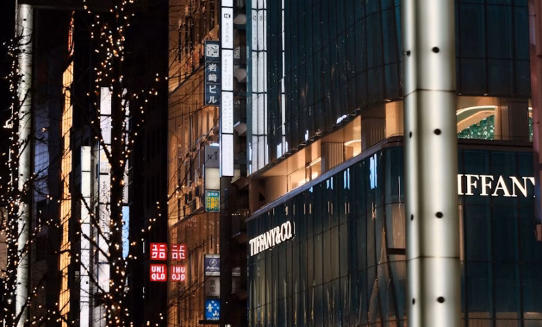 Ginza Tokyo shopping district at night with luxury storefronts, modern city lights, and sleek Tokyo urban architecture lining
