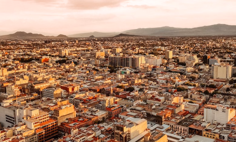 Aerial cityscape with historic landmarks, modern buildings, and winding streets, illustrating a smart one day city itinerary