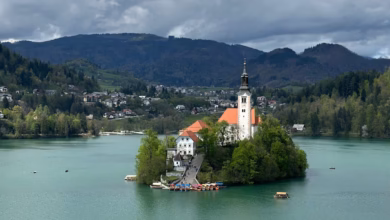 Lake Bled in Slovenia with emerald water, Bled Island, and the Julian Alps rising in the background.