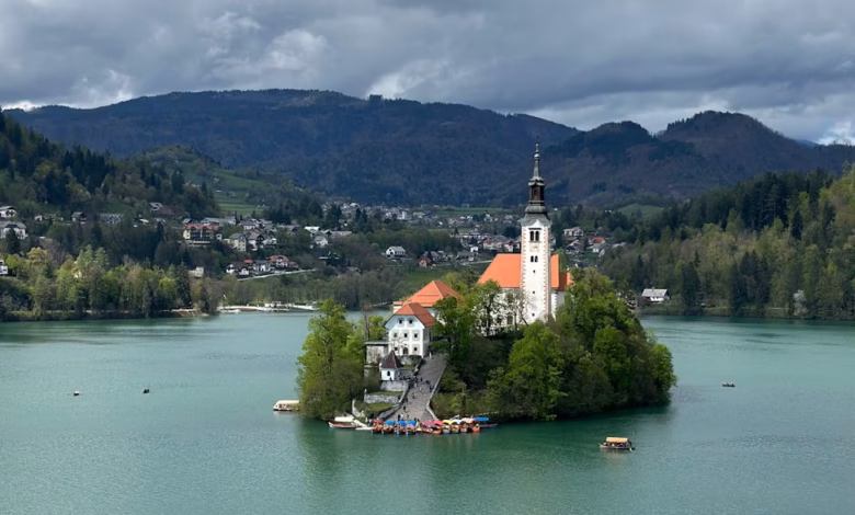 Lake Bled in Slovenia with emerald water, Bled Island, and the Julian Alps rising in the background.