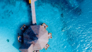 Overwater villas and turquoise lagoon at a Maldives luxury resort, with white sand beaches and tropical island scenery, ideal