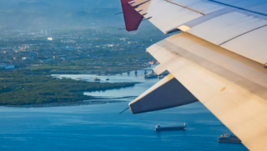 Modern travel destination cityscape with hotels, airport skyline, and coastal vacation scenery at sunset, ideal for travel de