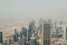 Aerial view of Dubai Marina skyline with modern skyscrapers, waterfront towers, and marina canals, highlighting one of the be